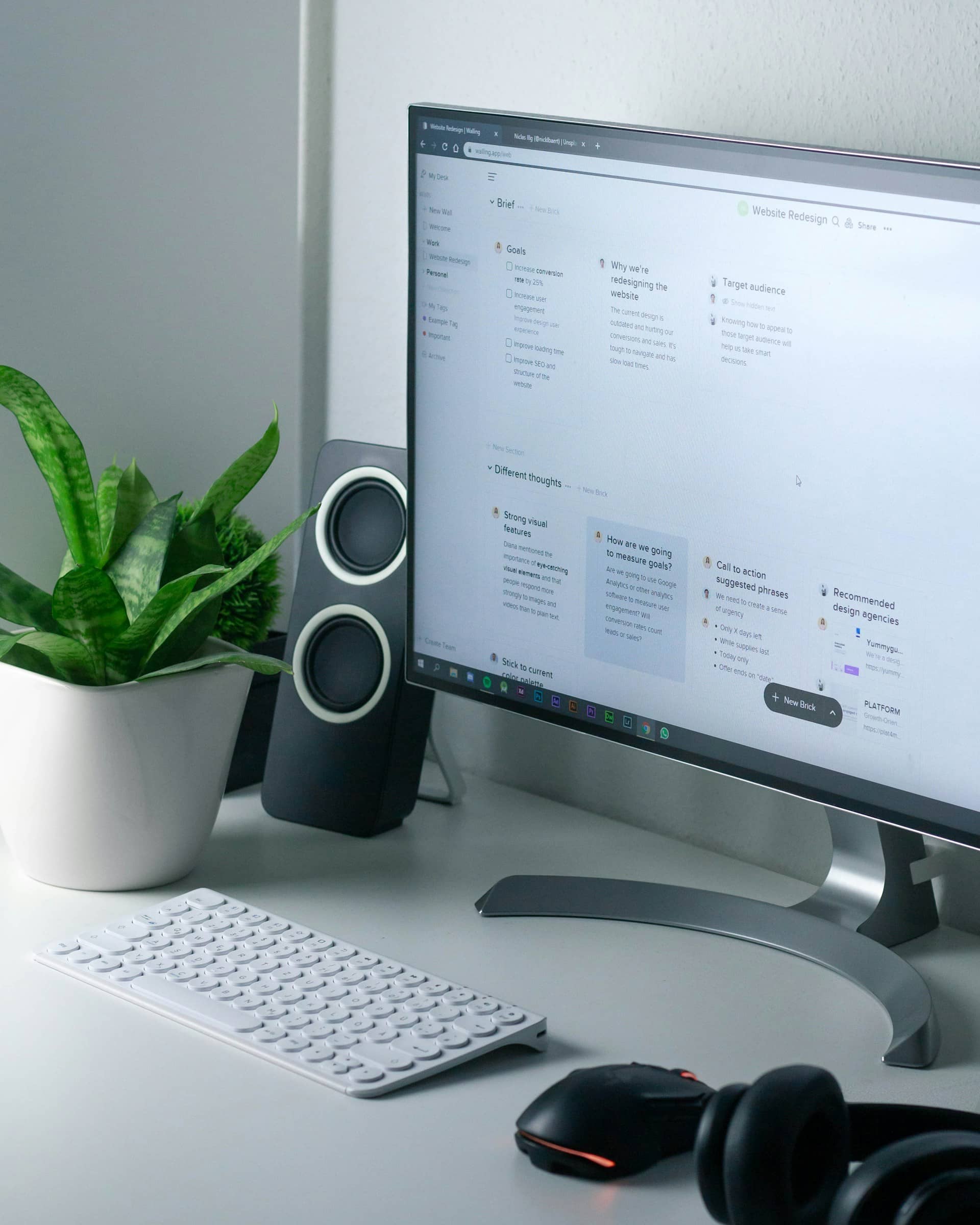 Stock image of a grey desktop with white keyboard
